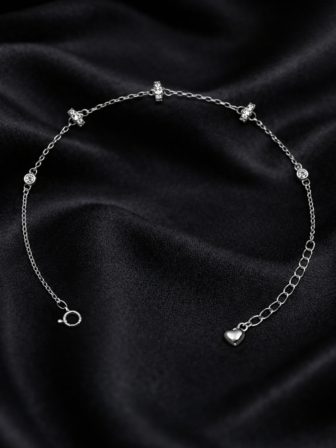 Original silver bracelet for ladies with crystal-studded ring charms