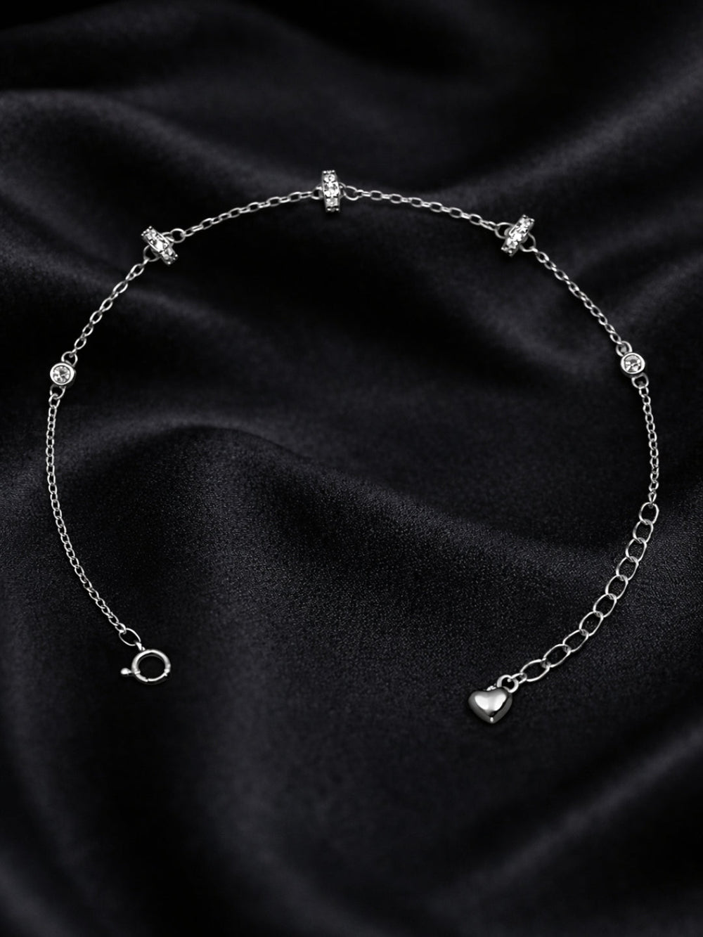 Original silver bracelet for ladies with crystal-studded ring charms