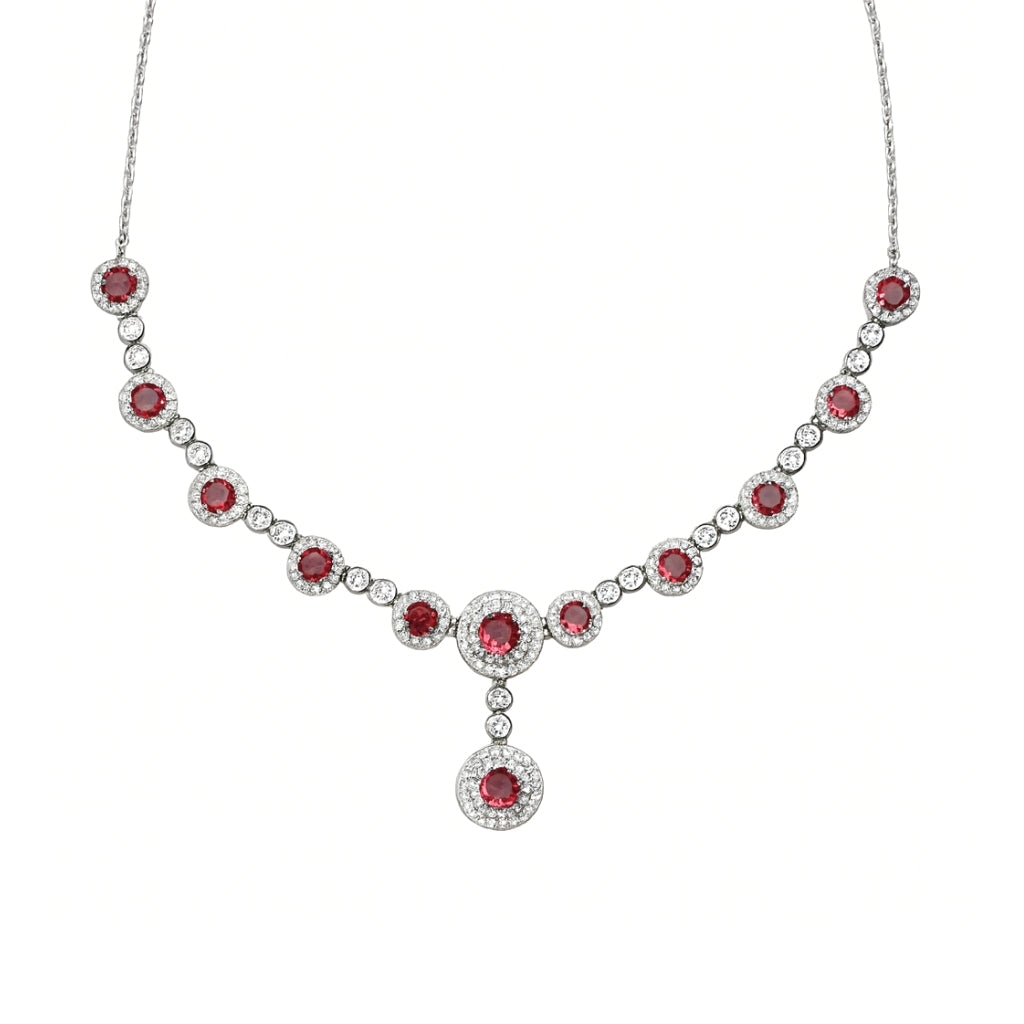 Silver necklace set for women with ruby red stones and matching earrings